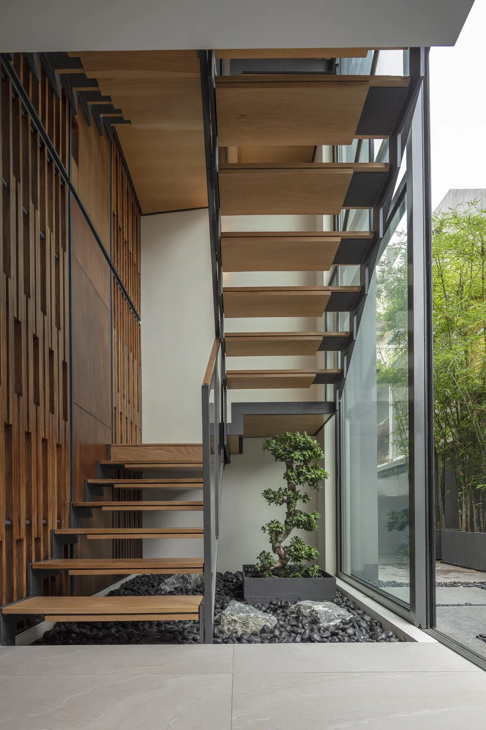 The main staircase looks out to the side garden.