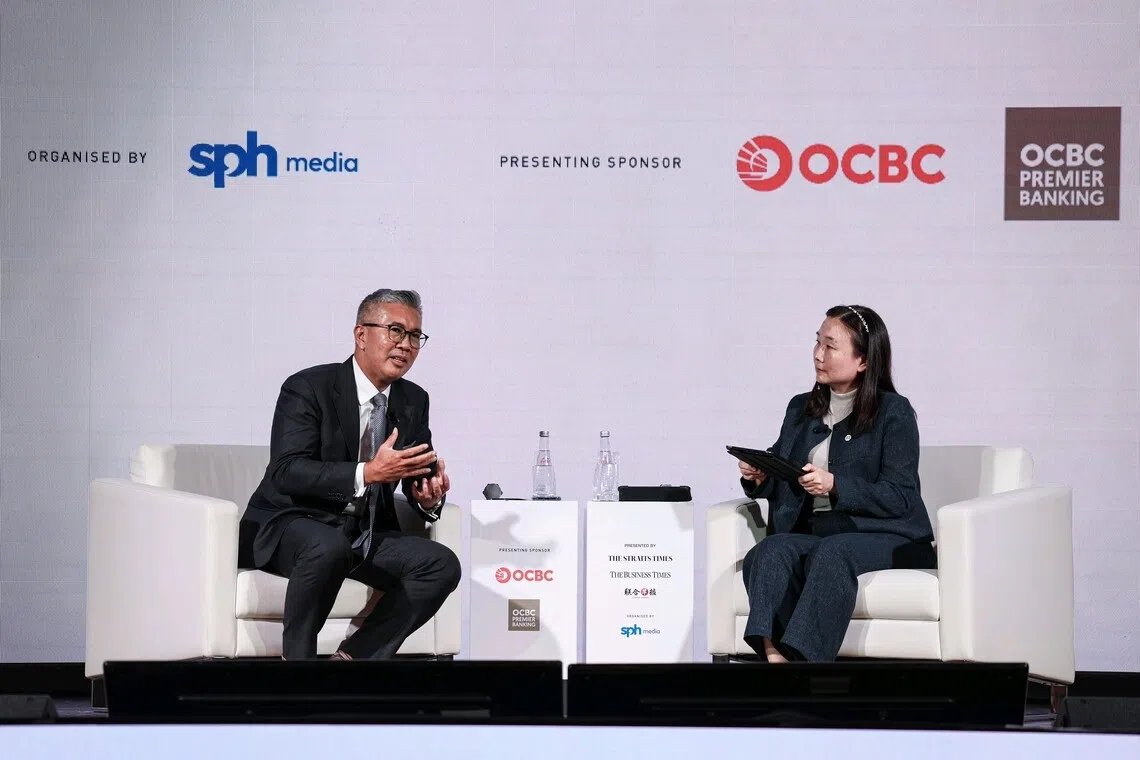 Malaysia’s Investment, Trade and Industry Minister Tengku Zafrul Abdul Aziz (left) speaking during a fireside chat with Business Times editor Chen Huifen at the Asia Future Summit 2025 on Oct 8.