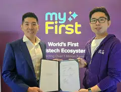 Fu Yu group chief executive and executive director David Seow (left) and myFirst co-founder and chief executive G-Jay Yong.