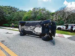 Tiger Woods' Land Rover rolled over on a two-lane road near his Jupiter Island home.