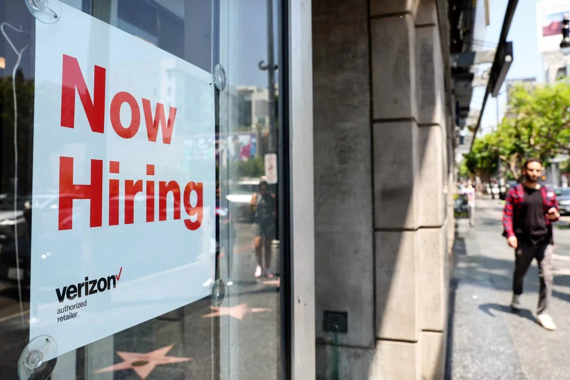 A 'Now Hiring' sign in Los Angeles. United States Federal Reserve chair Jerome Powell hopes that lower demand could reduce labour market pressure without raising unemployment — but historically, whenever vacancies come down substantially, unemployment goes up.