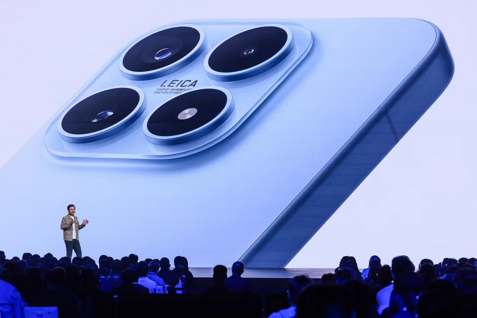 Founder, chairman, and CEO of Xiaomi Group, Lei Jun, speaks during the launch of the Xiaomi 17 series smartphone in Beijing on Sep 25.