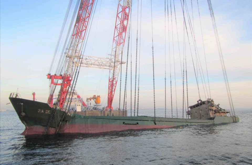 Salvors at work, Nippon Salvage company raises a sunken freighter in Tokyo Bay. There are genuine concerns that as the industry contracts, the pool of skilled salvage personnel will become too small.