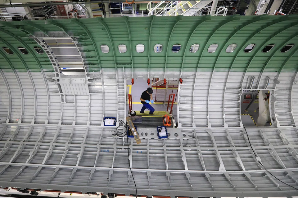 Airbus pushed back its goal to produce 75 of its A320 single-aisle jets per month by one-year to 2027.