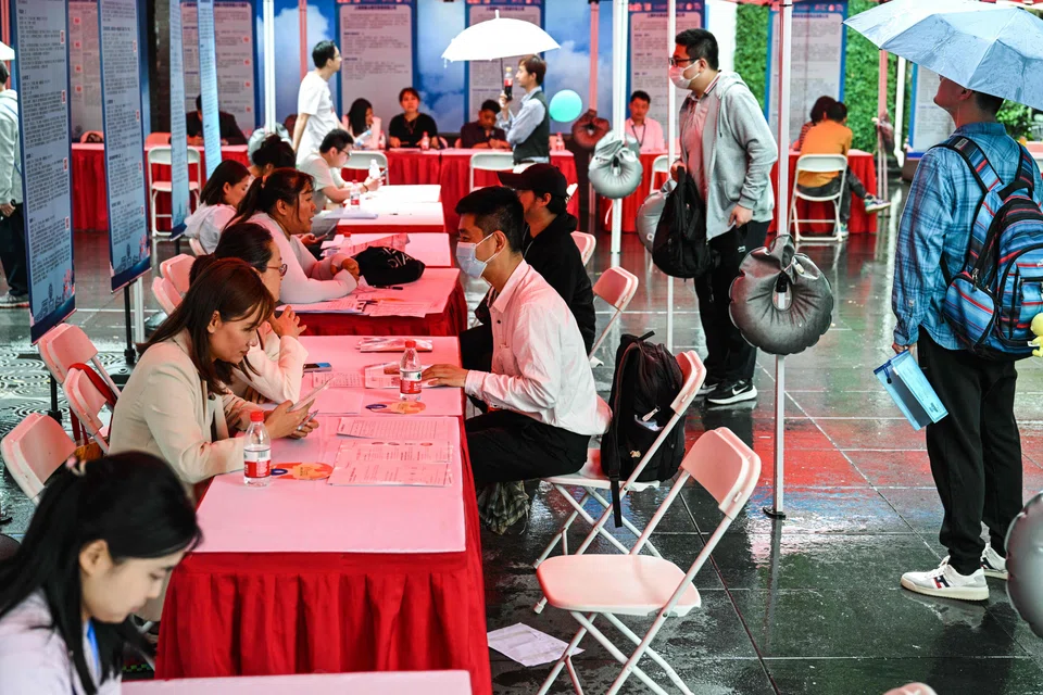 A sense of resigned gloom also pervaded a slim-pickings job fair in Shanghai.