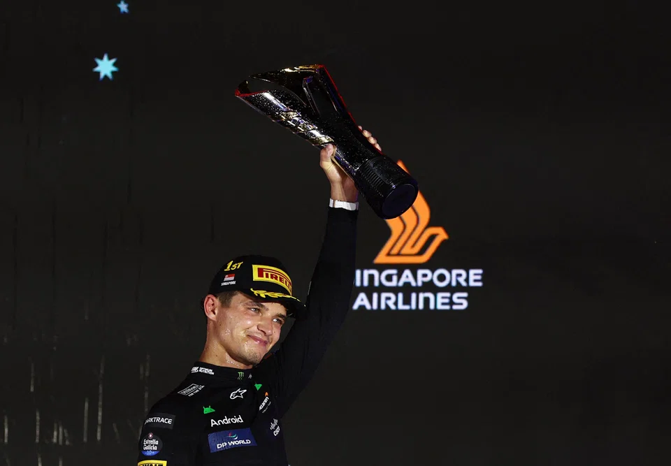 McLaren's Lando Norris celebrating after winning the Singapore Grand Prix in 2024. SIA has been the title sponsor of F1 Singapore for 11 years.