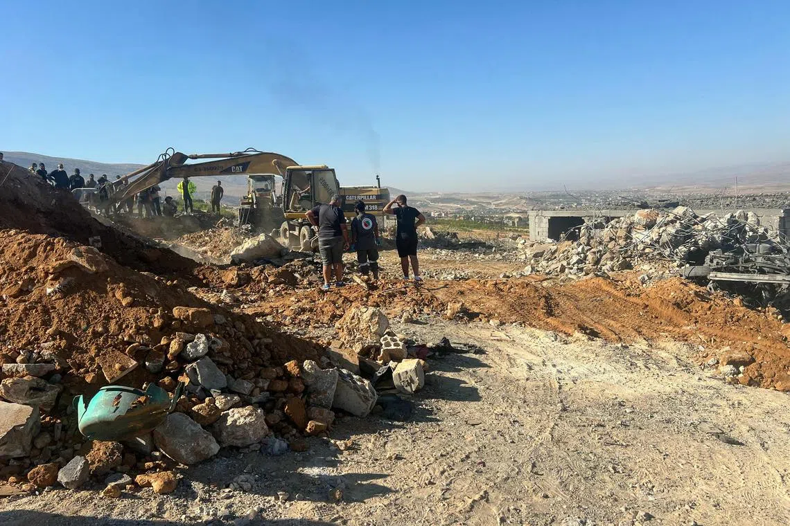 Rescuers remove the rubble of a house levelled overnight by an Israeli air strike in Lebanon's eastern Bekaa valley on Sunday.