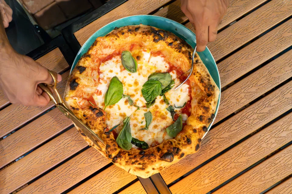 Vincenzo's provole e pepe is its signature pizza.