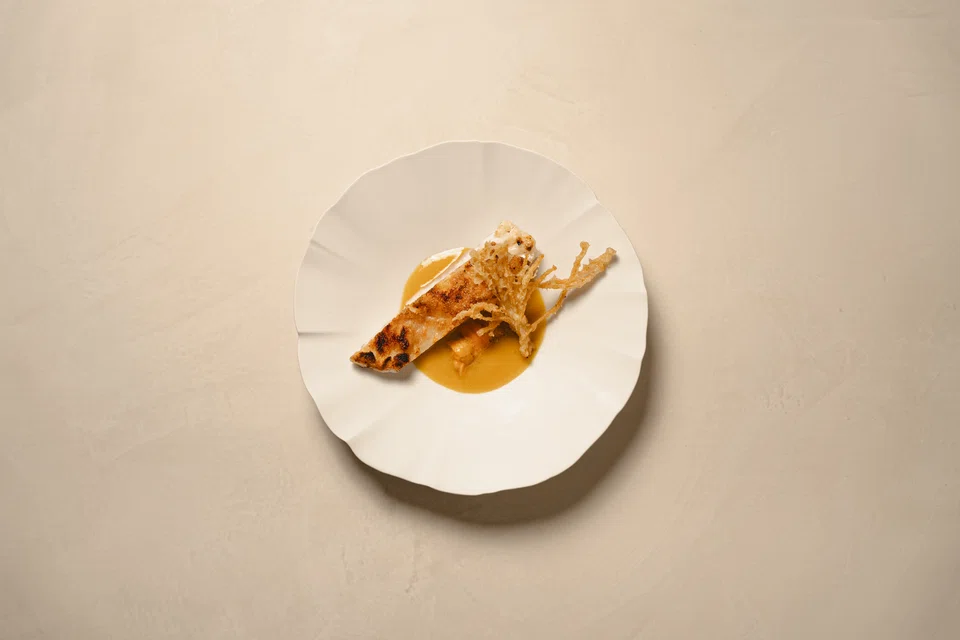 Grouper in golden pumpkin sauce.