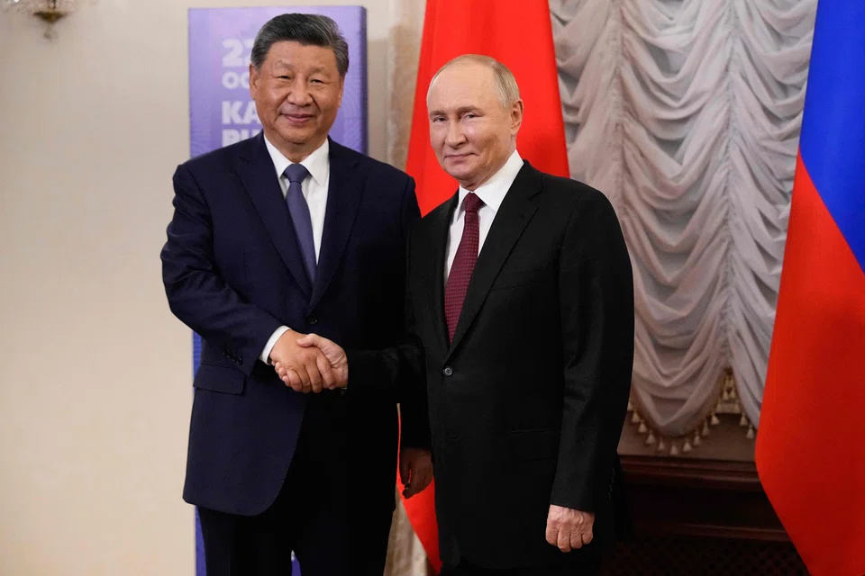 Russia's President Vladimir Putin meets with Chinese President Xi Jinping on the sidelines of the Brics summit in Kazan on Oct 22, 2024. 