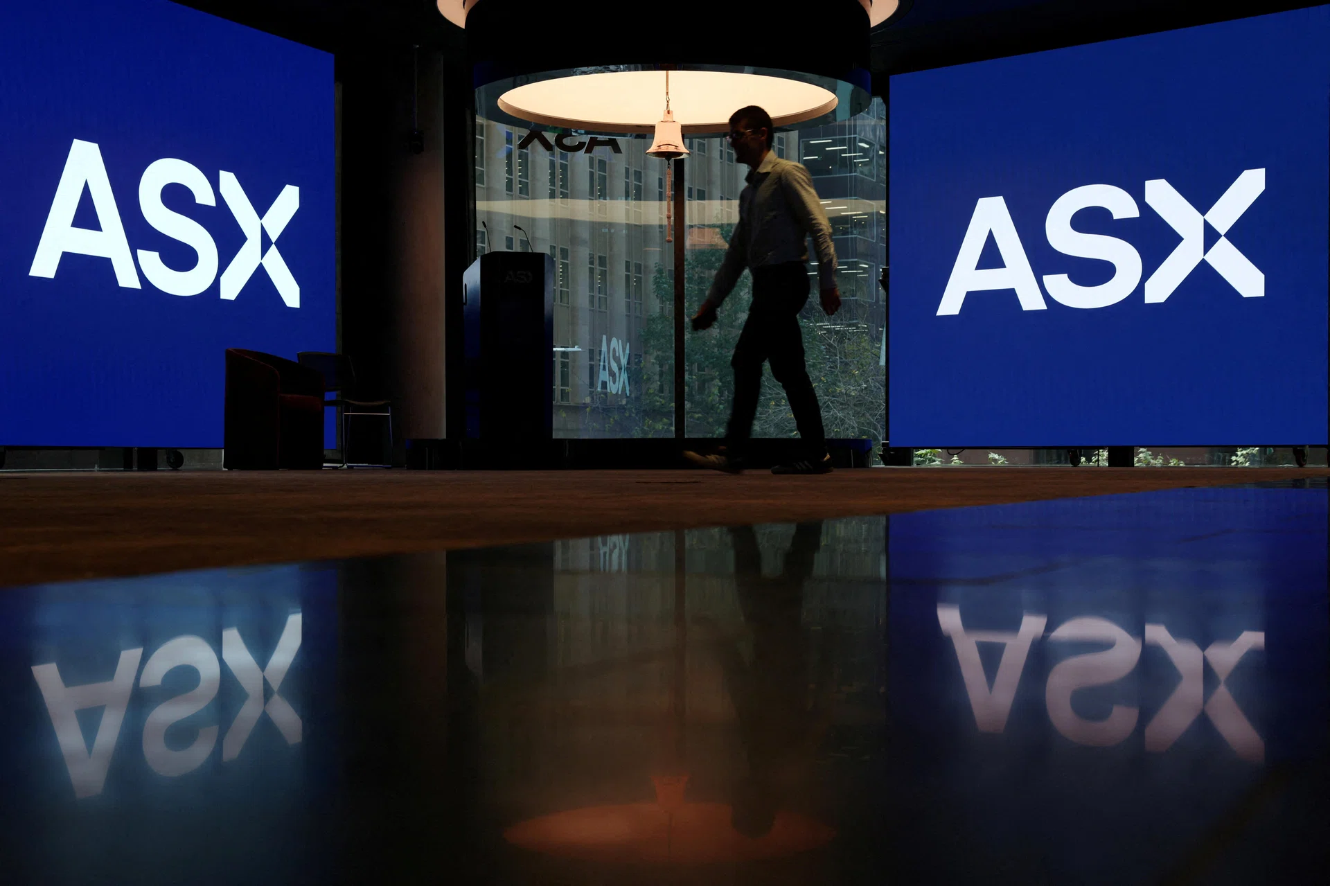 Australian shares slip as RBA decision looms, NAB posts profit miss