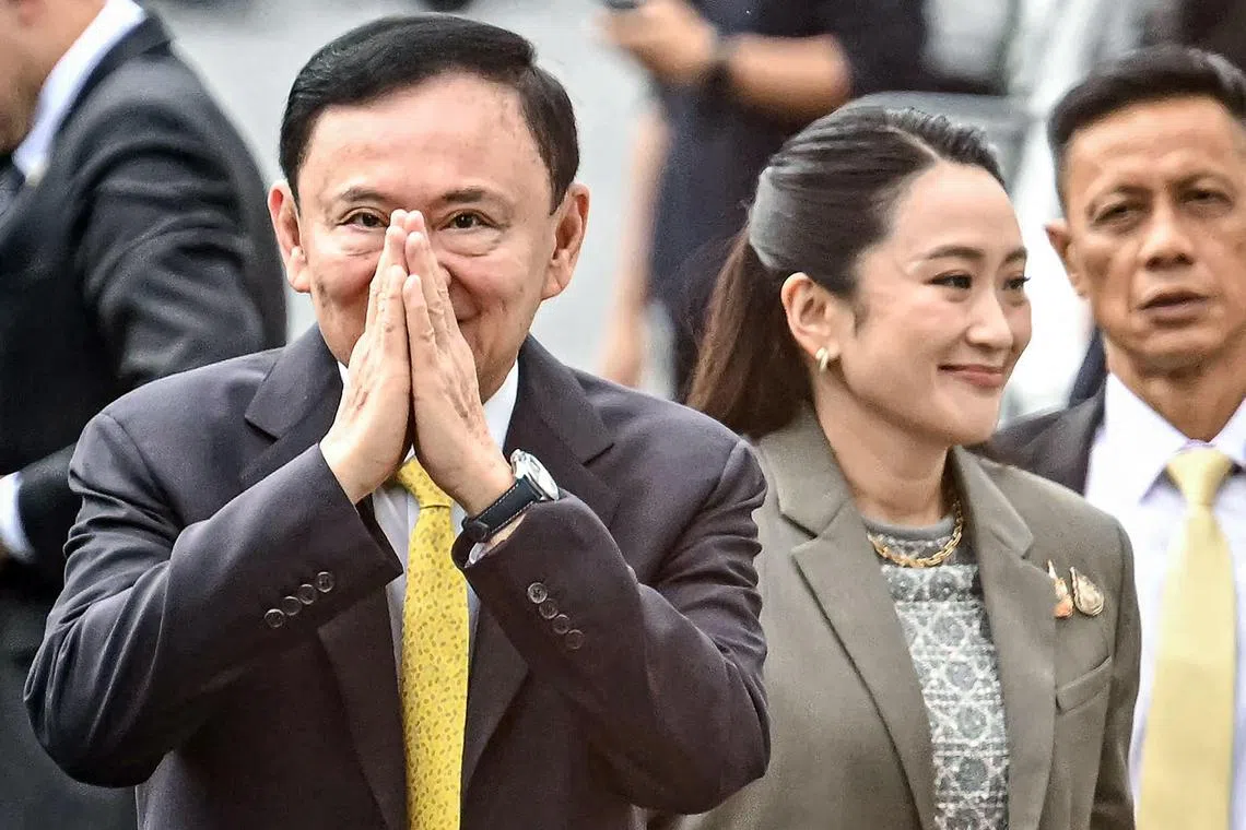 Former Thai PM Thaksin Shinawatra (left) was sentenced to one year in jail on Tuesday. Next to him is his daughter, former PM Paetongtarn Shinawatra who was recently ousted from office.
