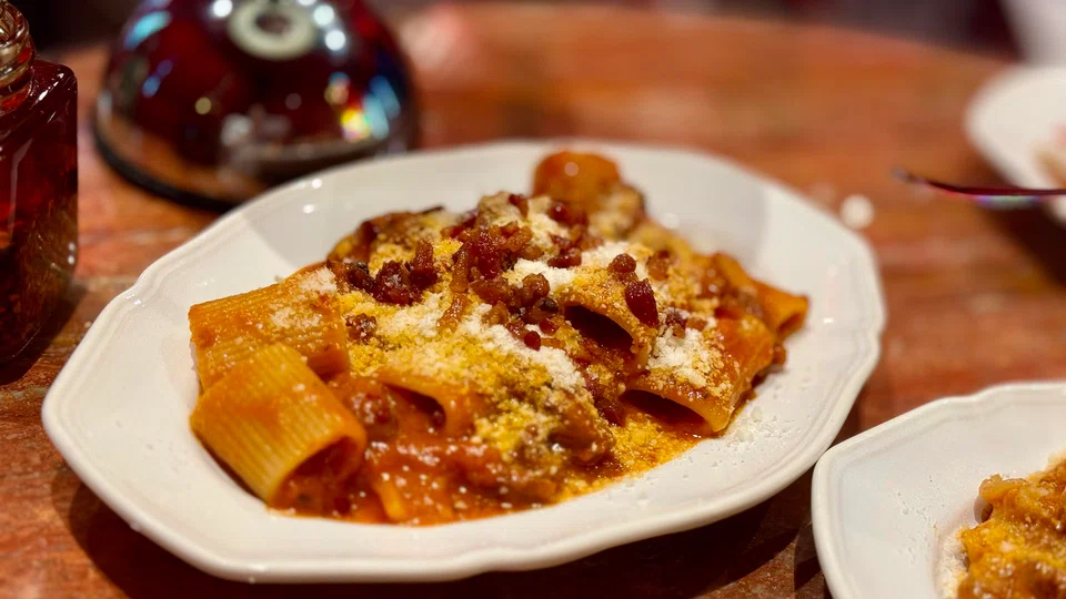 Mezza maniche is tomato-based pasta with bacon and cheese.