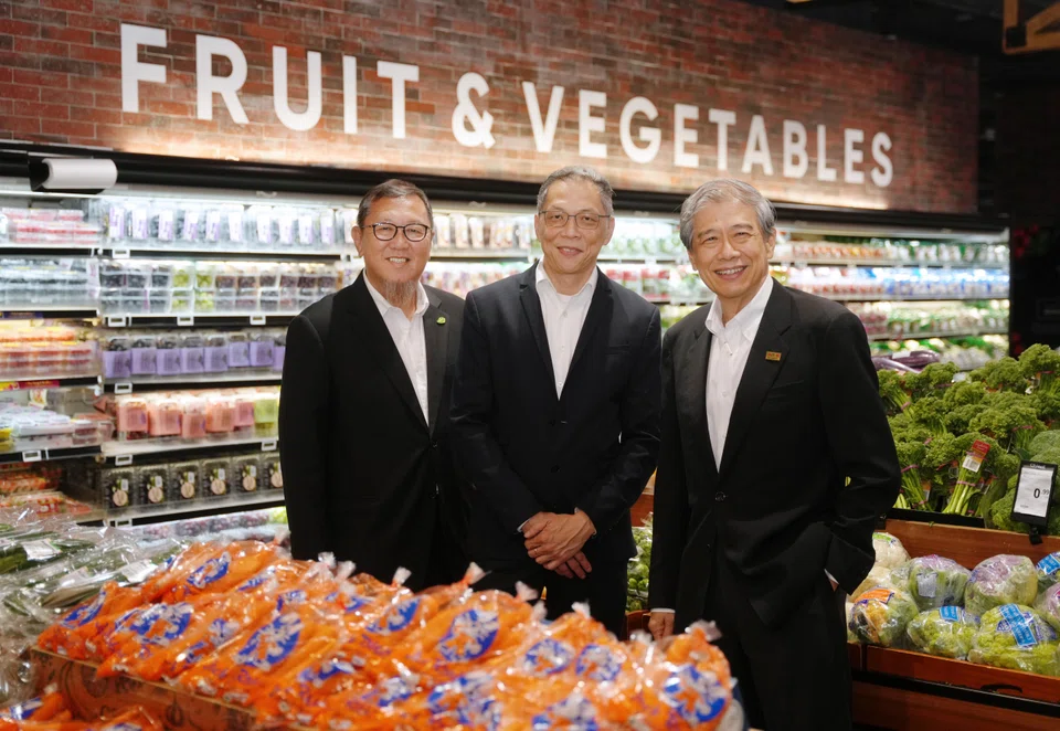 Cold Storage managing director Lim Boon Cheong with Macrovalue's owners Gary Yap (left) and Andrew Lim at CS Fresh in Great World City.