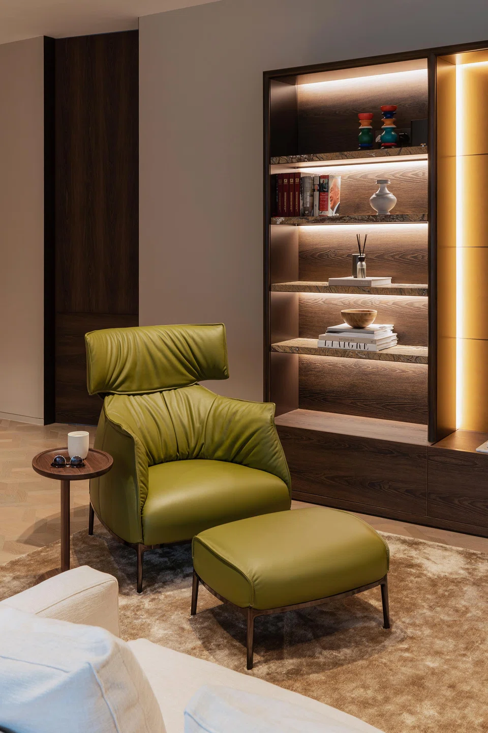 The son’s living room is tied together with an Archibald armchair from Poltrona Frau.