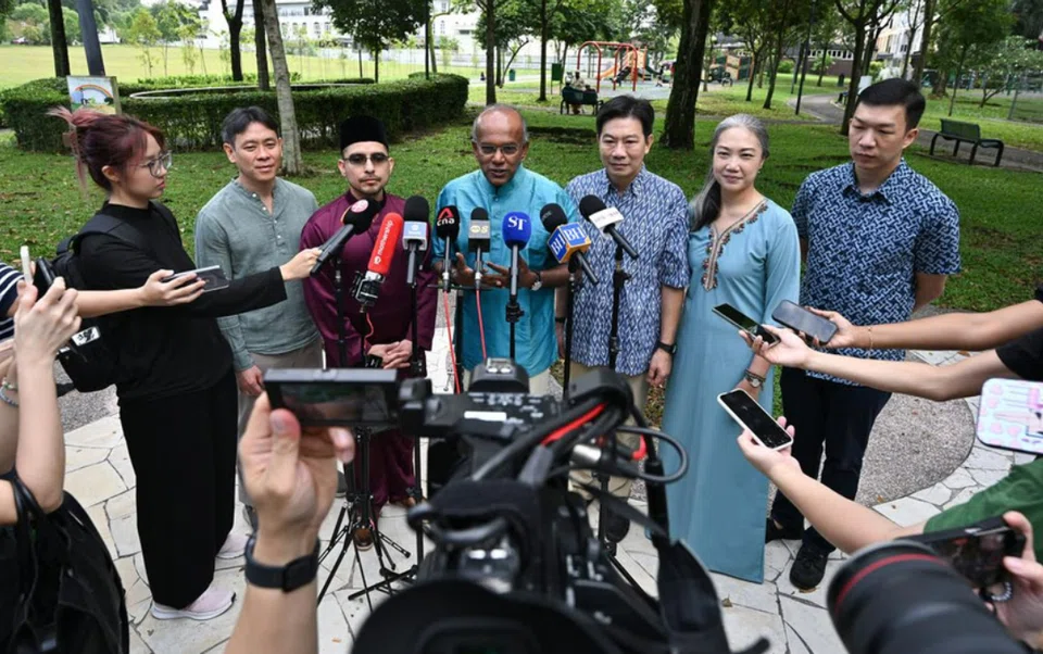 (From left) MP Louis Ng, Dr Syed Harun Alhabsyi, Law and Home Affairs Minister K Shanmugam, MPs Derrick Goh and Carrie Tan, and Jackson Lam speaking to the media outside Ahmad Ibrahim Mosque on March 31.