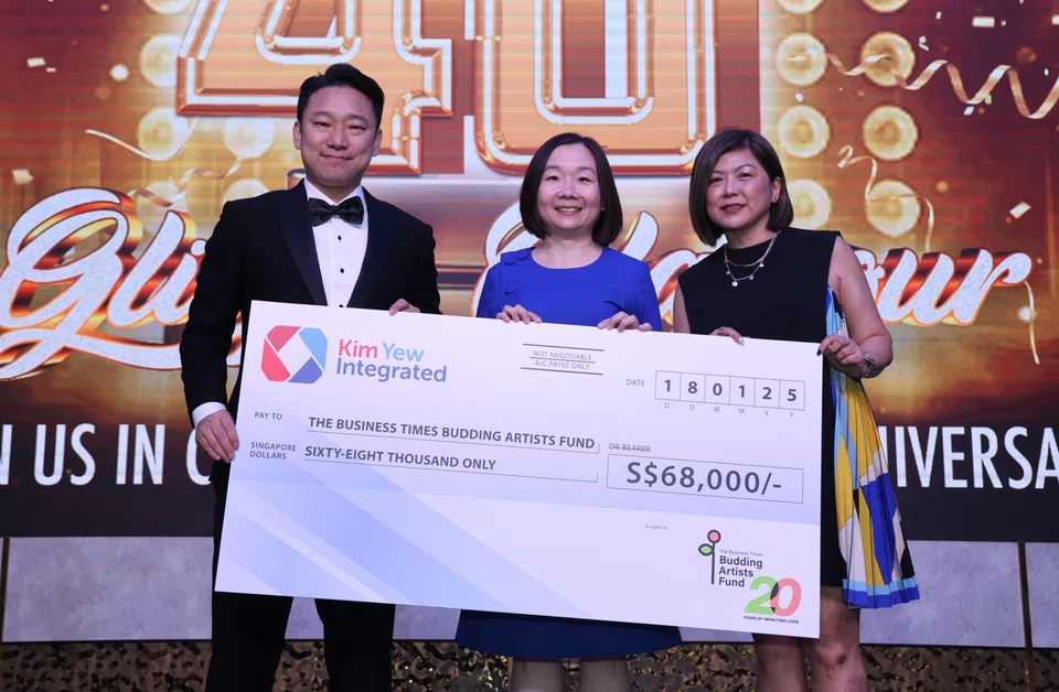 Kim Yew managing director Patrick Tan (left) presents a cheque to BT editor Chen Huifen (centre) and TRCL's head of partnership development Elaine Tan.