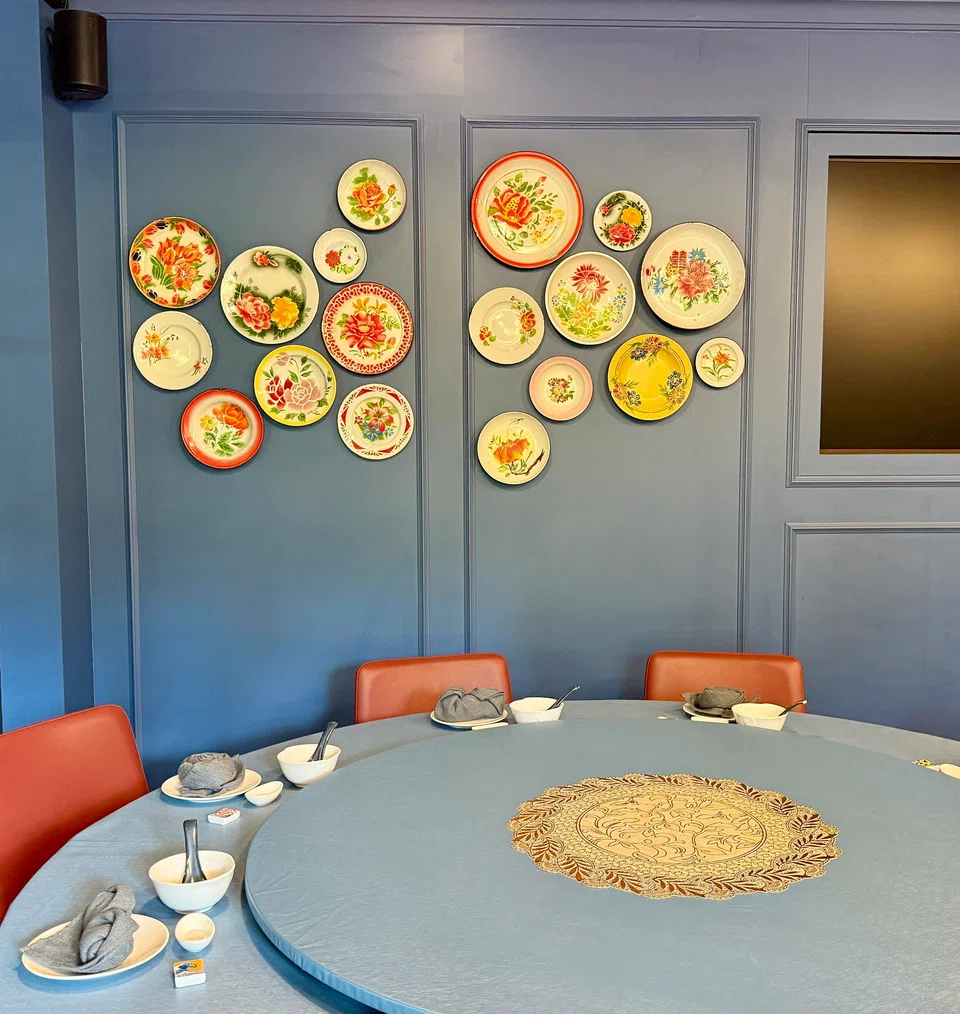 Vintage enamel plates decorate one wall.