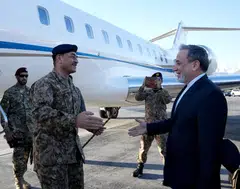 Iran's Foreign Minister Abbas Araghchi (right) welcomes Pakistan’s army chief Field Marshal Asim Munir (left) at an airport in Teheran on Apr 15.