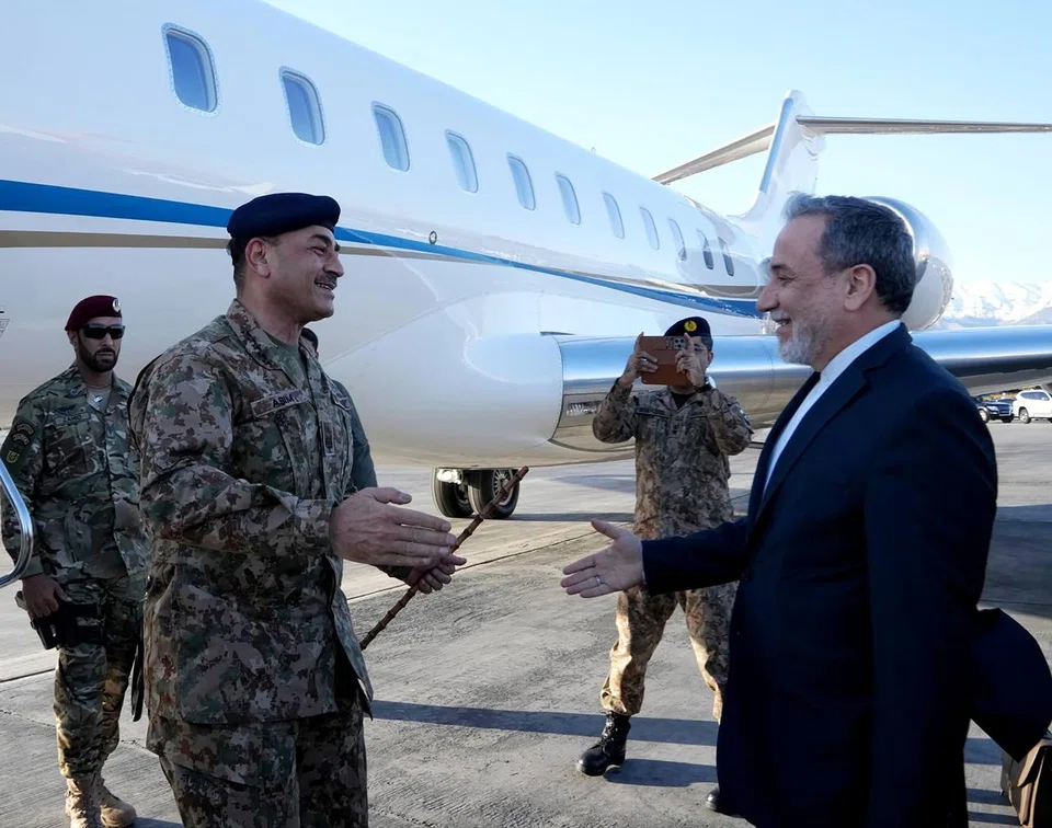 Iran's Foreign Minister Abbas Araghchi (right) welcomes Pakistan’s army chief Field Marshal Asim Munir (left) at an airport in Teheran on Apr 15.
