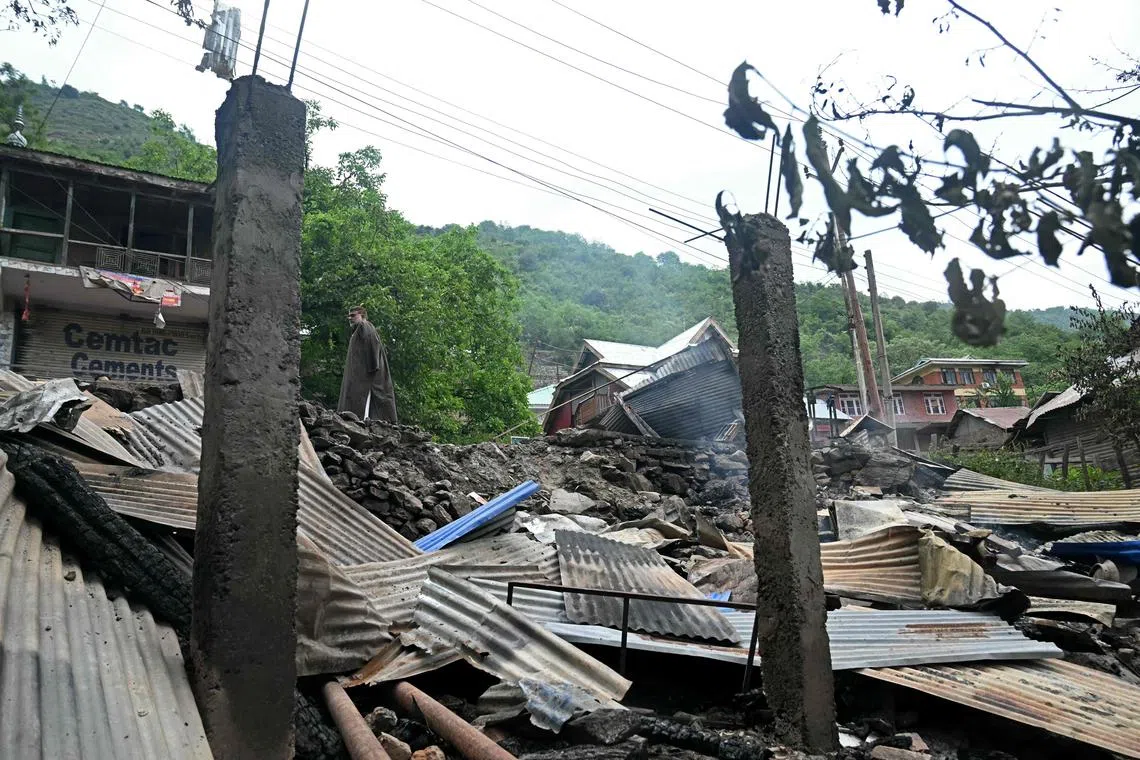 A local resident inspects the debris of his house that was destroyed by Pakistani artillery shelling at the Lagama village in Uri, India, May 9, 2025. 
