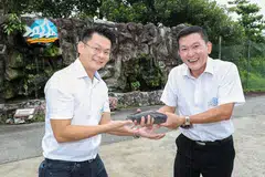 Kenny Yap (right) handing over the helm to nephew Yap Kok Cheng.