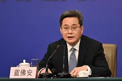 Finance Minister Lan Foan calls on all parties to strengthen multilateral cooperation, saying that China supported dialogue and consultation “on equal footing” to settle trade and tariff disputes.