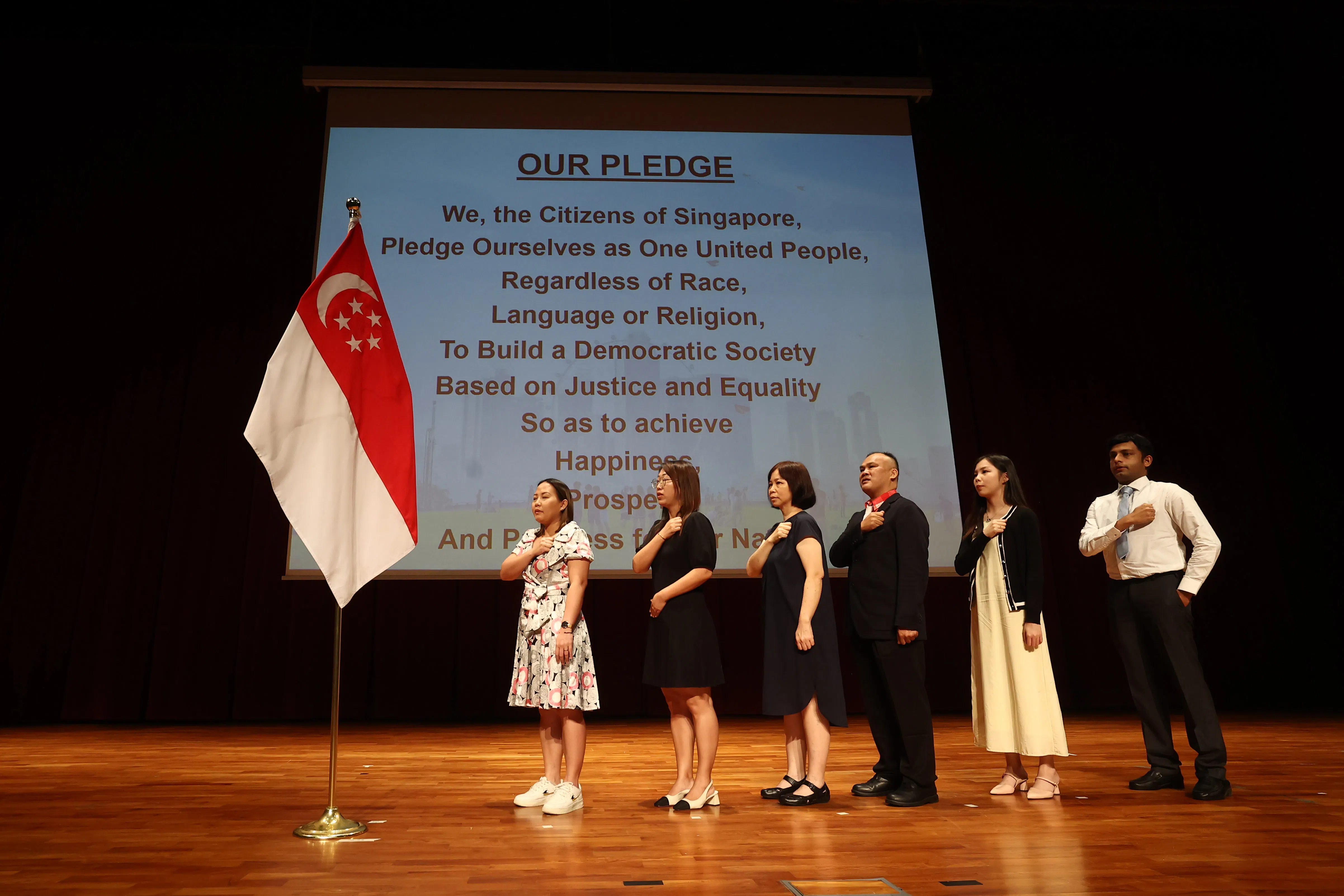 New citizens reciting the Singapore pledge at a citizenship ceremony in August 2024. Last year, 23,472 individuals were granted citizenship, a 1.7% increase over 2022.