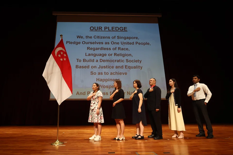 New citizens reciting the Singapore pledge at a citizenship ceremony in August 2024. Last year, 23,472 individuals were granted citizenship, a 1.7% increase over 2022.