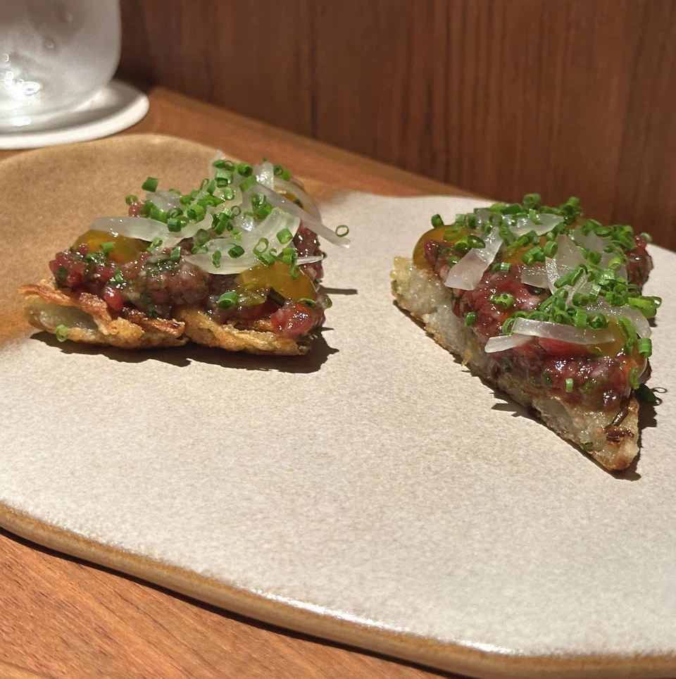 "Pizza" of potato jeon and yukhwae (beef tartare).