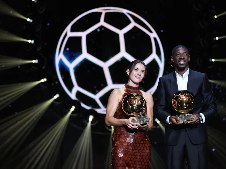 Spanish midfielder Aitana Bonmati and  French forward Ousmane Dembele with their awards during the 2025 Ballon d'Or award ceremony at the Theatre du Chatelet in Paris.