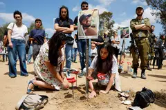 Visitors at the site of the Nova festival, where partygoers were killed or kidnapped during the Oct 7 attack by Hamas gunmen from Gaza, on Israel's Memorial Day, when the country commemorates fallen soldiers of Israel's wars and Israeli victims of attacks. 