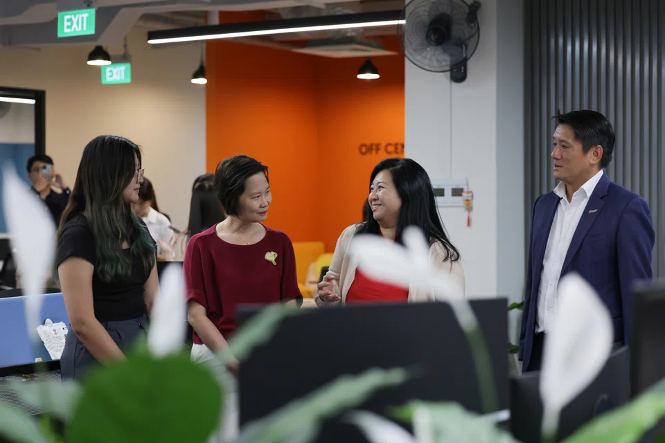 In the foreground, from left: AsiaOne Online editorial strategist Lim Ke Wei meeting Minister of State for Manpower Gan Siow Huang, National Trades Union Congress director for women and family Yeo Wan Ling, and Singapore National Employers Federation honorary secretary Edwin Ng on Wednesday (Jan 31), when the workgroup drawing up the flexi-work guidelines visited AsiaOne.  
