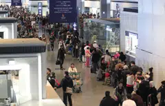 File photo of passengers at Narita airport. One runway at Narita airport has been closed due to the emergency landing of a cargo plane, public broadcaster NHK reported on Tuesday.