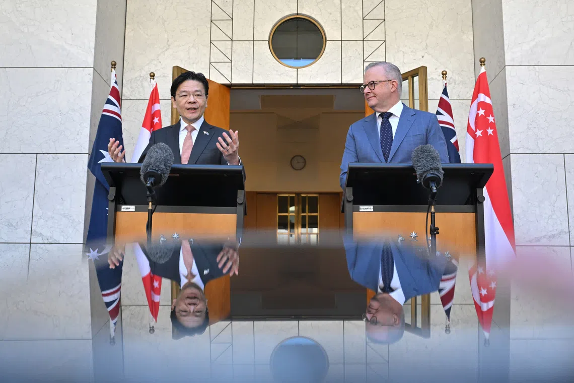 The world is becoming more uncertain and unsettled, but Australia and Singapore share “a common strategic perspective that is built on a deep reservoir of trust”, says Singapore's Prime Minister Lawrence Wong (left) at a joint press conference in Canberra with Australian Prime Minister Anthony Albanese.