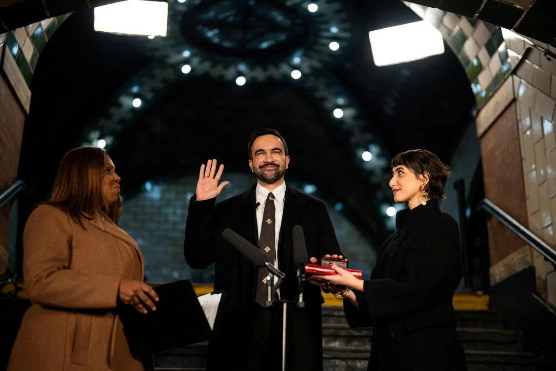 Zohran Mamdani is sworn in as mayor of New York City shortly after midnight on Jan 1.  He is flanked by his wife, Rama Duwaji, (right) and New York Attorney-General Letitia James.