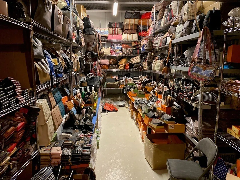 One of the storage units filled with counterfeit luxury goods seized by New York authorities. Two men were charged with trafficking the counterfeit items.