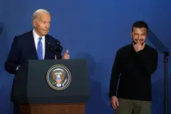 US President Joe Biden (left) introducing Ukraine President Volodymyr Zelensky (right) at the Nato summit in Washington, DC, July 11, 2024. 