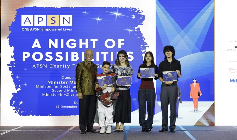 Minister for Social and Family Development Masagos Zulkifli with participating designers and models.