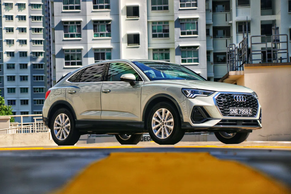 The Q3 Sportback’s roof sweeps gracefully down to its backside while its window line has a sporty upward kick, and there’s a tailgate spoiler to visually elongate the roof itself.