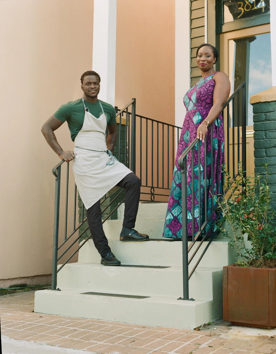 Serigne Mbaye and his business partner, Afua Richardson, outside Dakar Nola in New Orleans, Jan 27, 2023. A new generation is exploring how the city's food owes as much to West African and Caribbean cuisines as to Creole cooking.