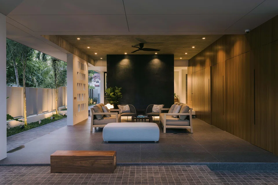 A comfortable semi-outdoor setting lets the family enjoy views of the surrounding garden and the street outside.