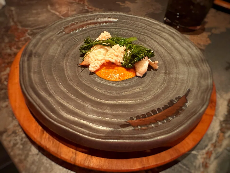 A thick yellow curry tends to overwhelm the tender pieces of lobster.