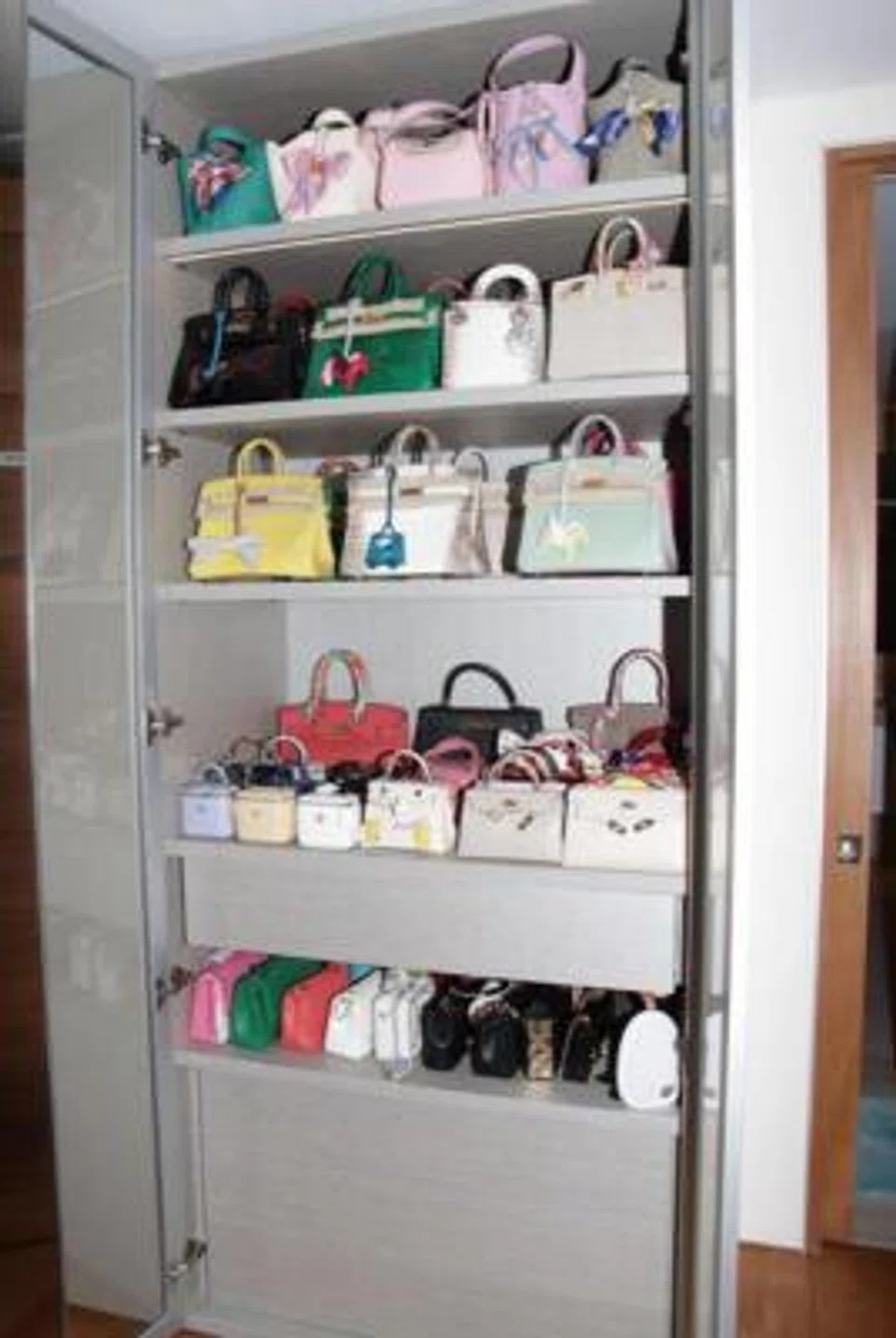 The seized assets comprise properties, vehicles, and luxury goods such as branded bags, watches, and alcohol.