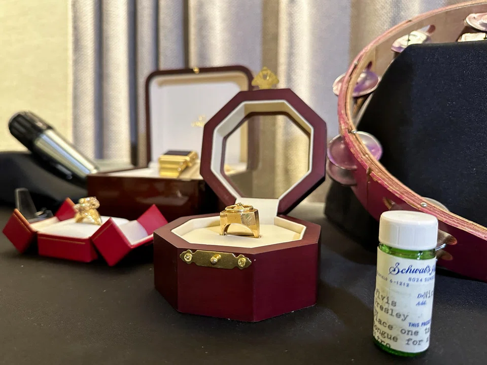 Elvis Presley's jewellery and pill bottle are displayed ahead of Artefacts of Hollywood & Music sale by GWS Auctions, in New York City on August 31.