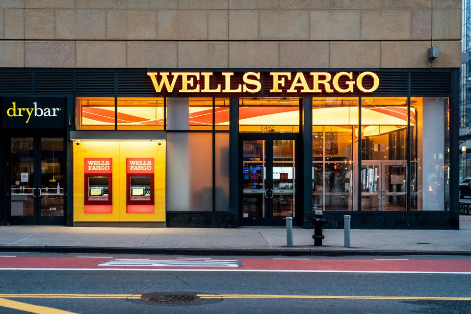 Wells Fargo, which has been under intense scrutiny since a 2016 fake accounts scandal, saw its stock close down 4 per cent, paring a 6.5 per cent loss after the Office of the Comptroller of the Currency announced the action earlier in the day.