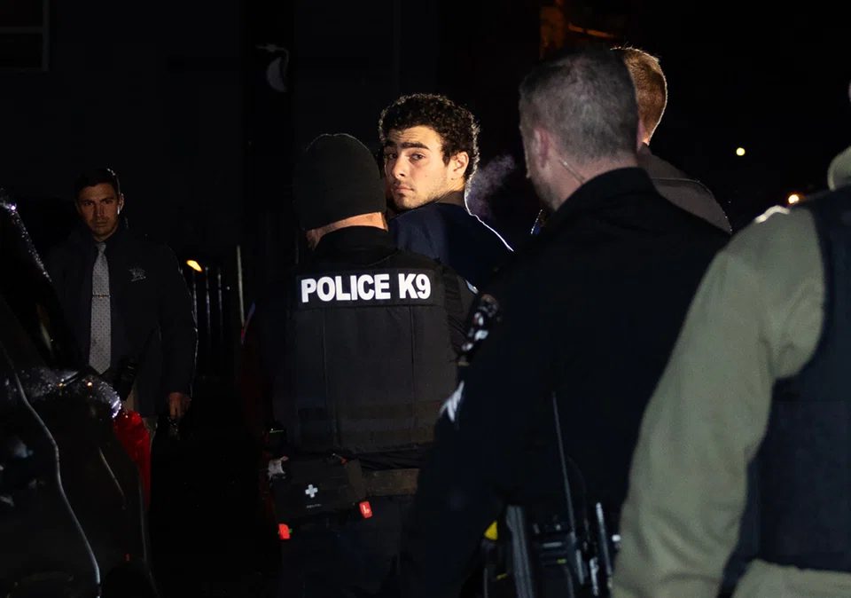 Luigi Mangione is escorted by police to his arraignment at the Blair County Courthouse in Hollidaysburg, Pennsylvania, Dec 9, 2024. 