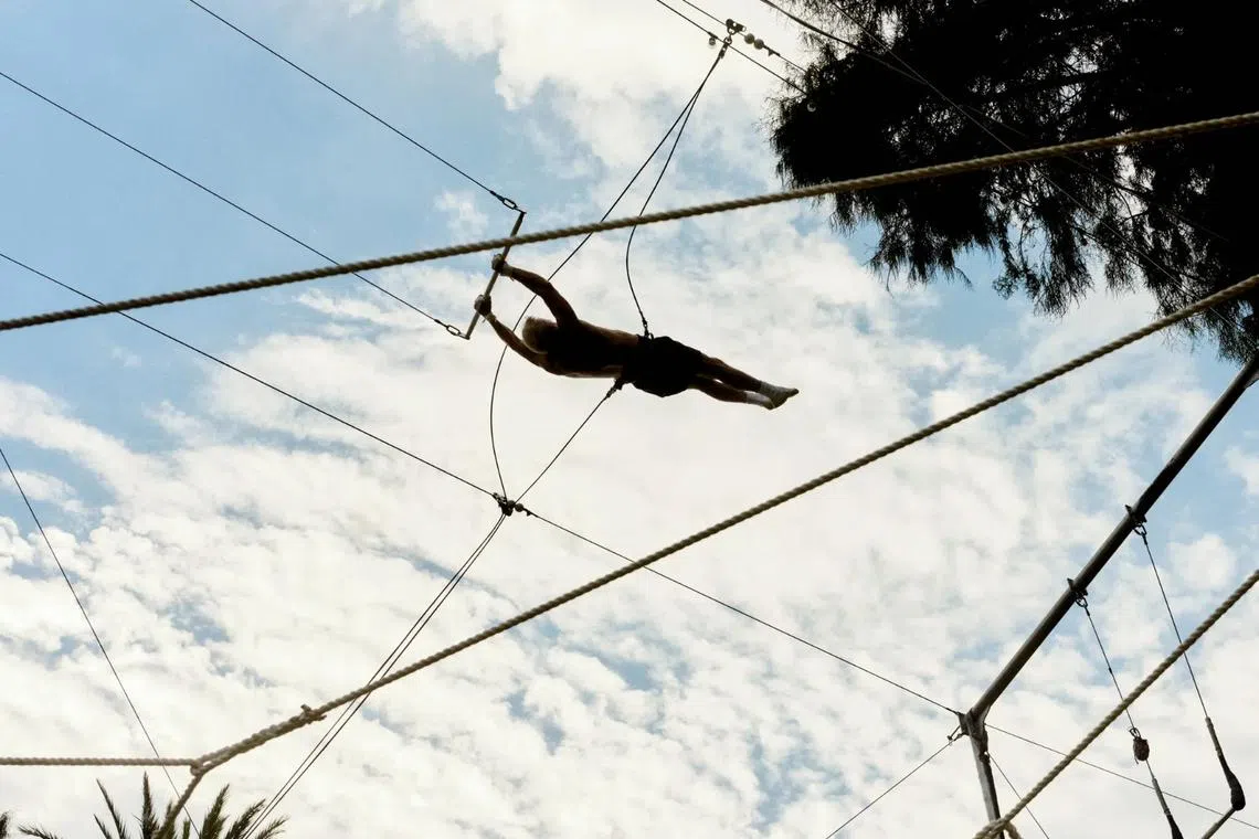 Moore in full flight practising a trick at the Santa Barbara Trapeze Co.