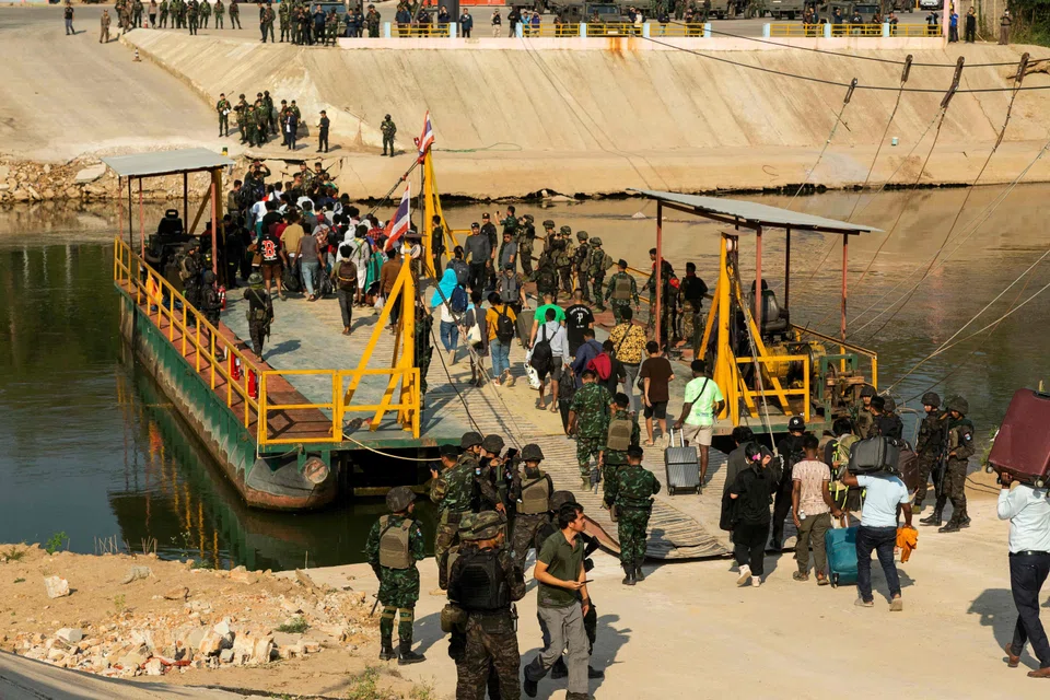 Alleged scam victims cross the river on the Myanmar-Thai border to be repatriated, but despite raids, Myanmar’s fraud factories accused of swindling billions from Chinese and US victims remain thriving.