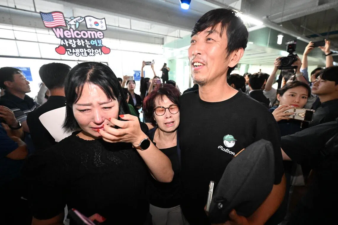 A South Korean worker (right), who was detained in a US immigration raid at a Hyundai-LG plant in Ellabell, Georgia, is welcomed by family members, Incheon, South Korea, Sep 12, 2025. 
